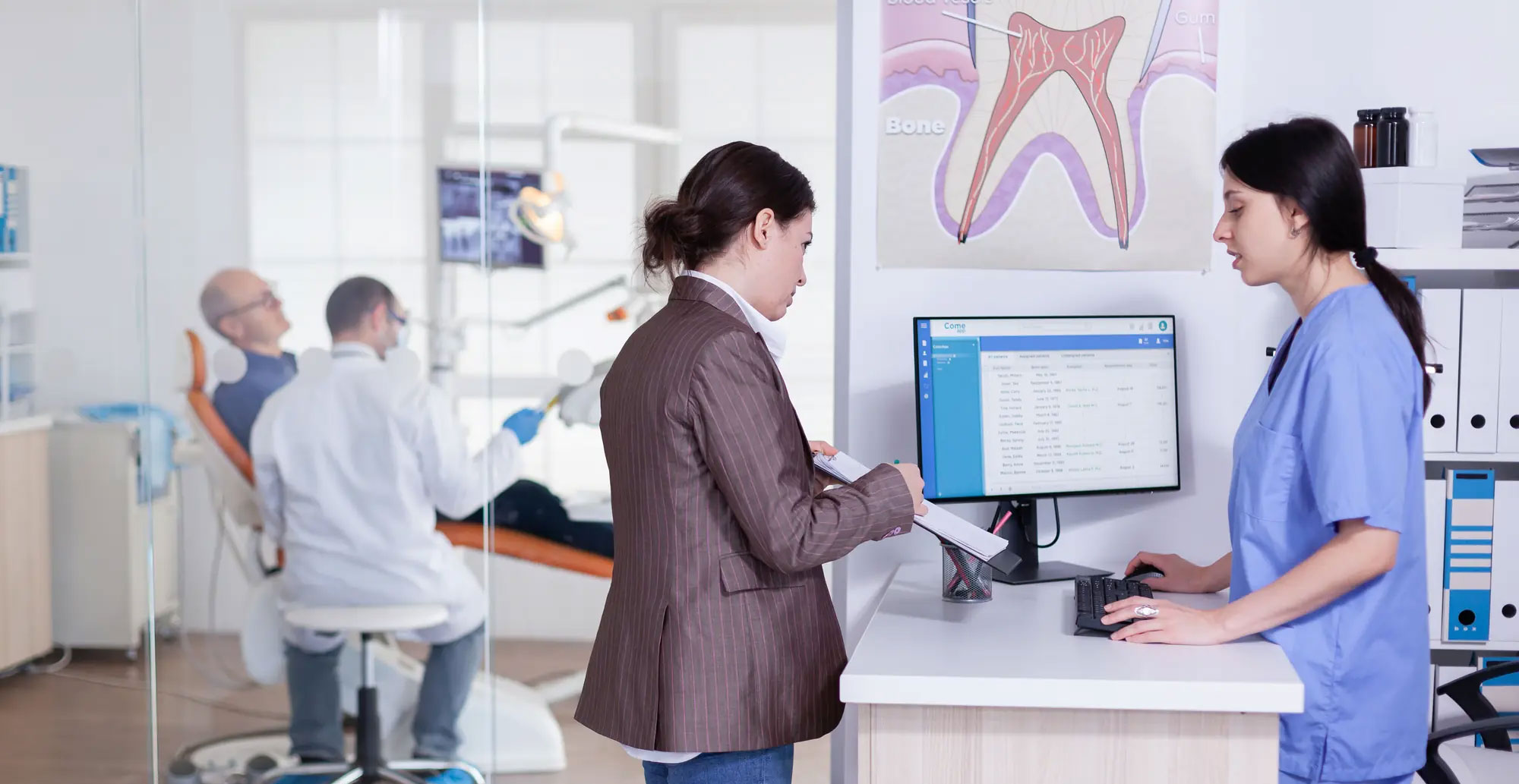 A medical office scene with a woman in a white coat, a man in a blue shirt, and a receptionist assisting a patient at a desk.